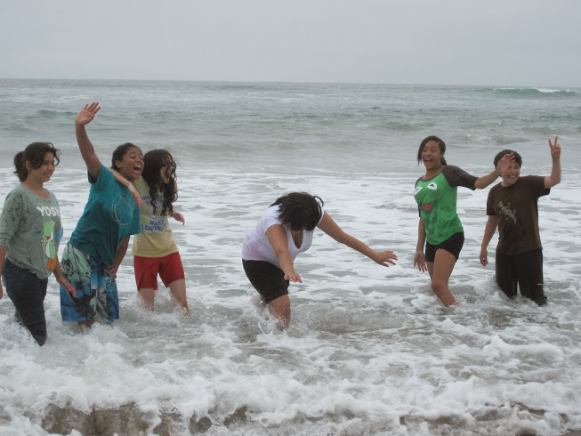 ICO participants play in the surf