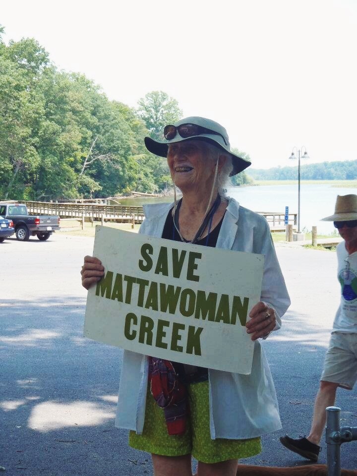 A local citizen and Sierra Club member holds a "Save Mattawoman Creek" sign
