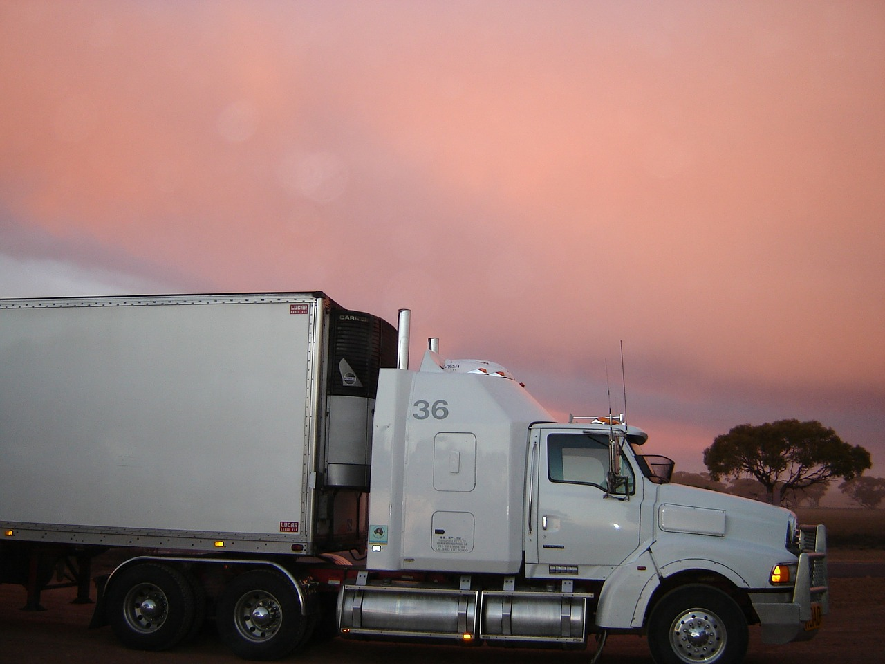 Profile of freight truck at sunset