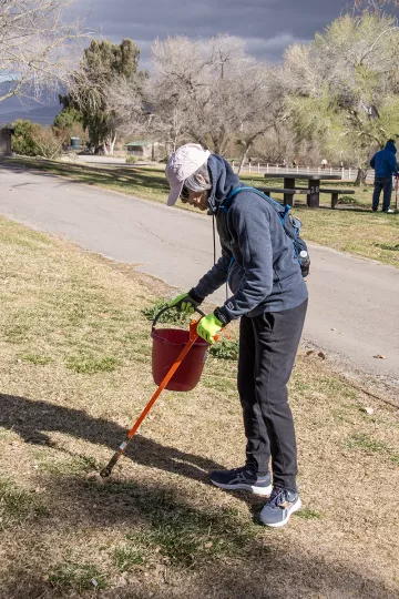outhern Nevada Group-Sierra Club member Lynn Lessard at the cleanup in this uniquely beautiful park surrounded by cottonwood trees, spacious green lawns, and ponds filled with trout.