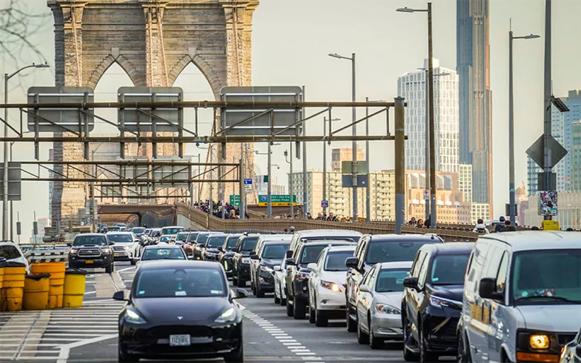 Cars going over the Brooklyn Bridge