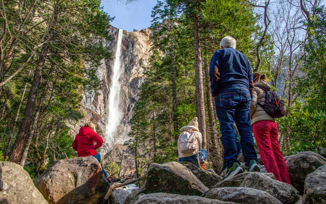 Yosemite National Park visitors take in the views of Bridalveil Fall in Yosemite Valley.