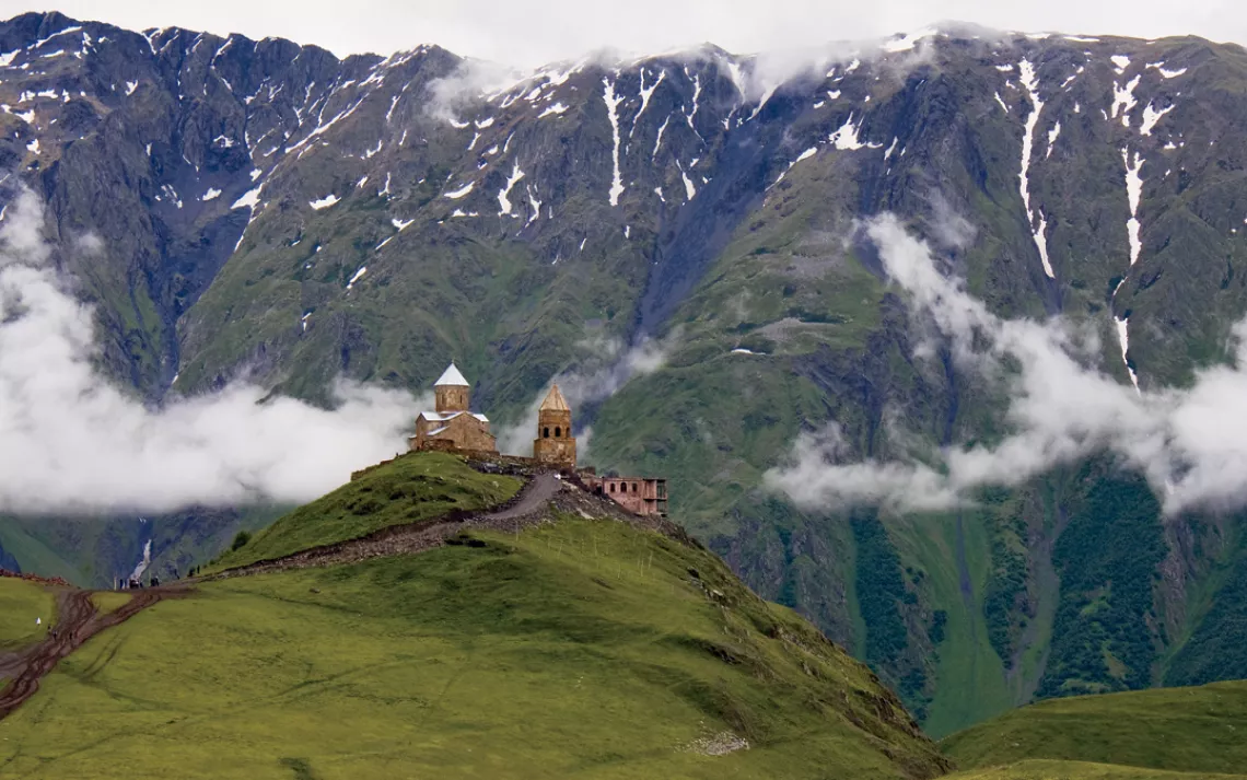 The Gergeti Trinity Church sits below 16,500-foMt. Kazbek in the Caucasus Mountains of Kazbegi, Georgia.