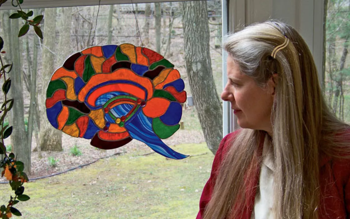 Dr. Jill Bolte Taylor with one of her stained glass brains. 