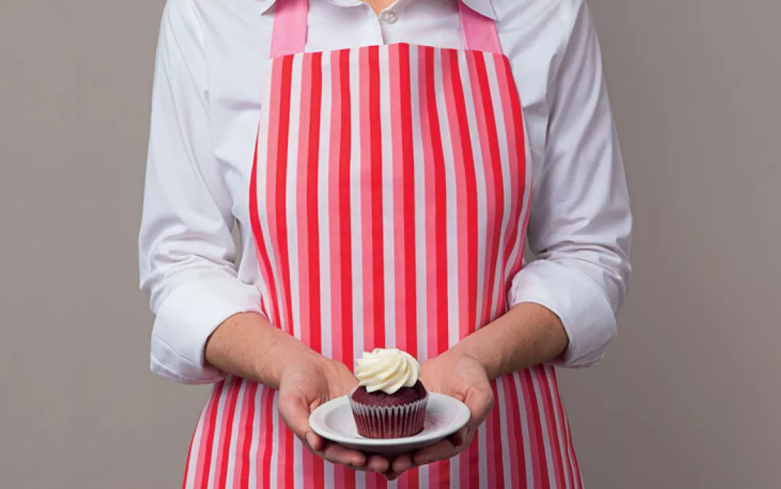 Repurpose your bedroom linens into a kitchen smock. 