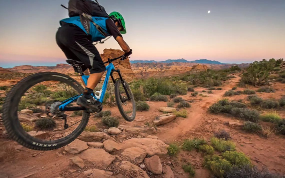 Tyson Swasey mountian biking on the Hymasa trail, Moab, Utah.