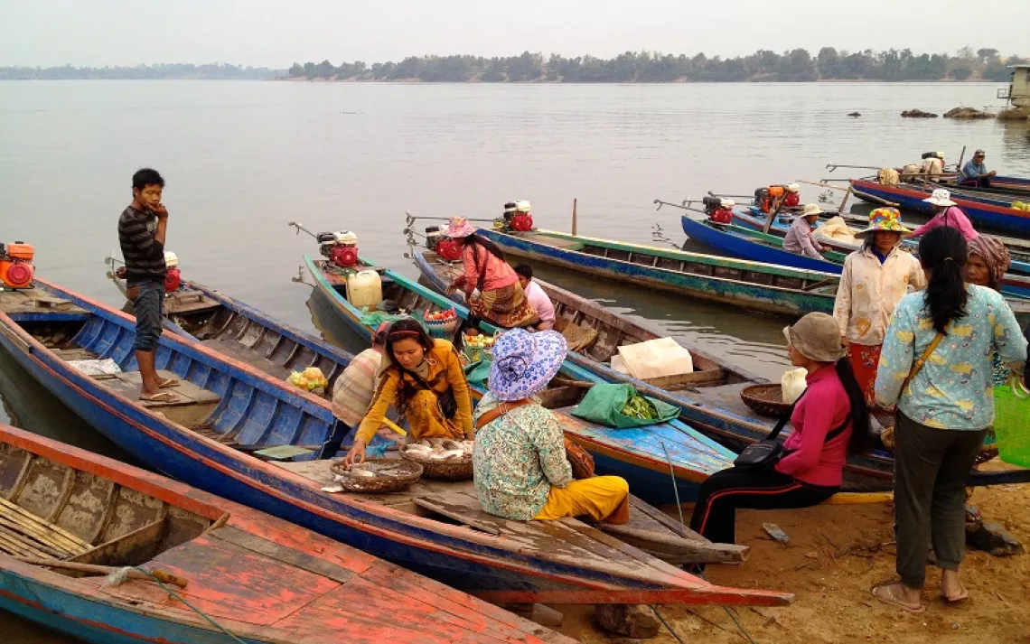 Cambodians dock their kayaks