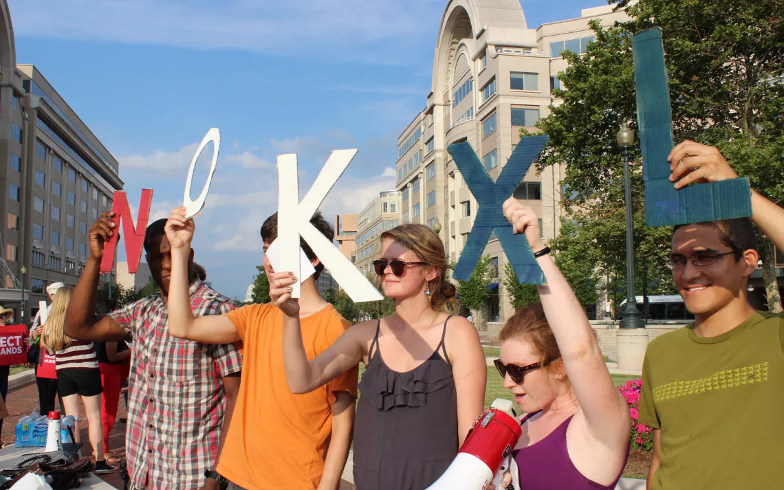 Volunteers and activists wait outside of the Mandarin Oriental in D.C. to reject the Keystone XLpipeline.