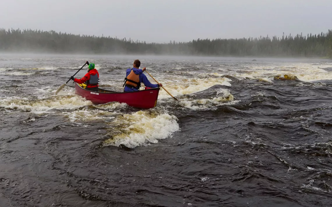 Pas de deux: Teamwork gets Conor and Kim Mihell down one of many rapids on northwestern Ontario's Otoskwin River.