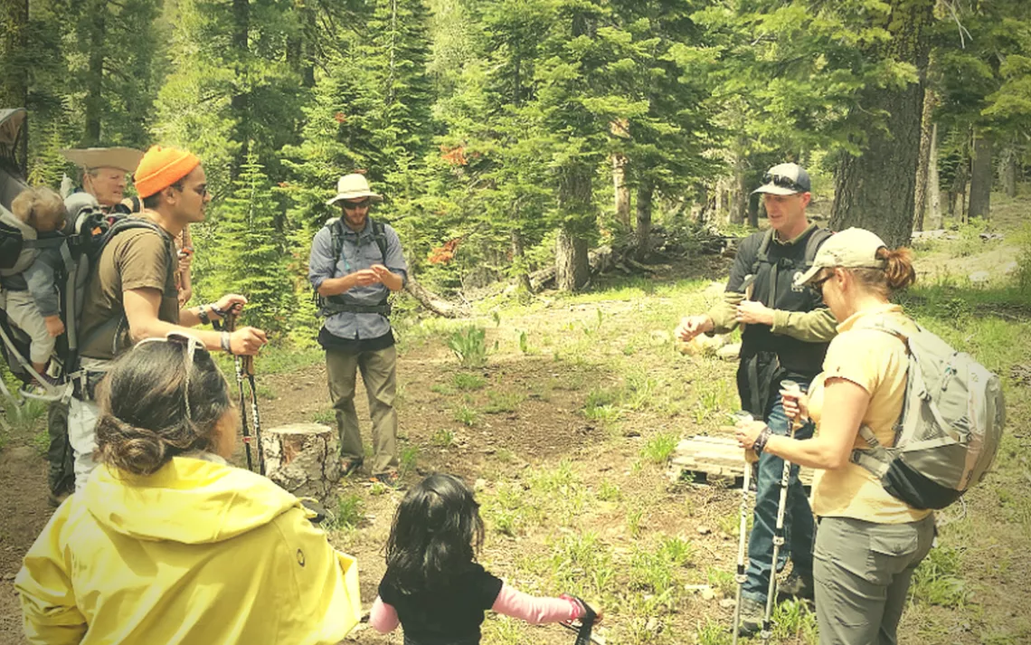 Before an afternoon hiking session, an expert from Gateway Mountain Center Guides gives the group some pointers.