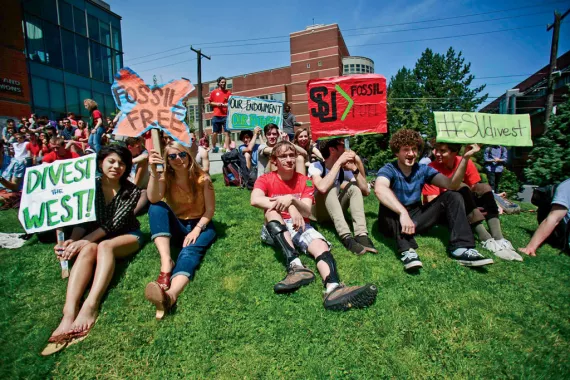 Students at Seattle University rally before delivering 600 petition signatures calling for divestment to the school's administration.