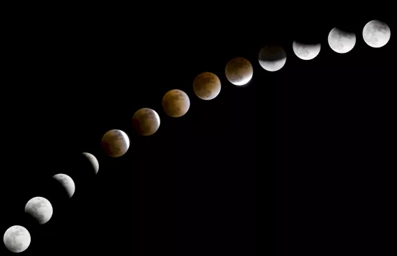 A series of images shows the progression of a lunar eclipse.