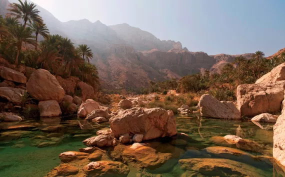 The emerald pools and orange blossoms of Wadi Tiwi almost distract climbers from their goal, the area's sheer sandstone pitches.