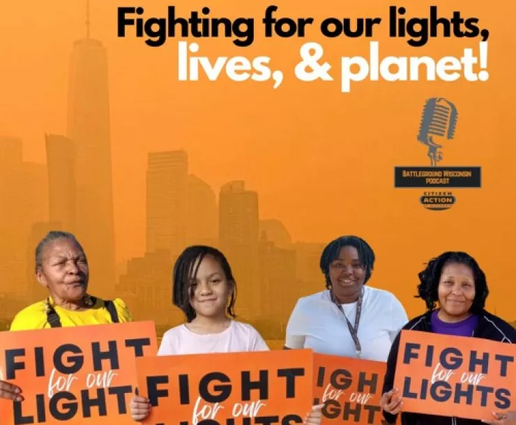 On an orange background, the text "fighting for our lights, lives and planet!" is at the top. The bottom of the image is 4 people, each holding a "fight for our lights" sign. The people are a range of ages and skin tones; all are Black or Brown.