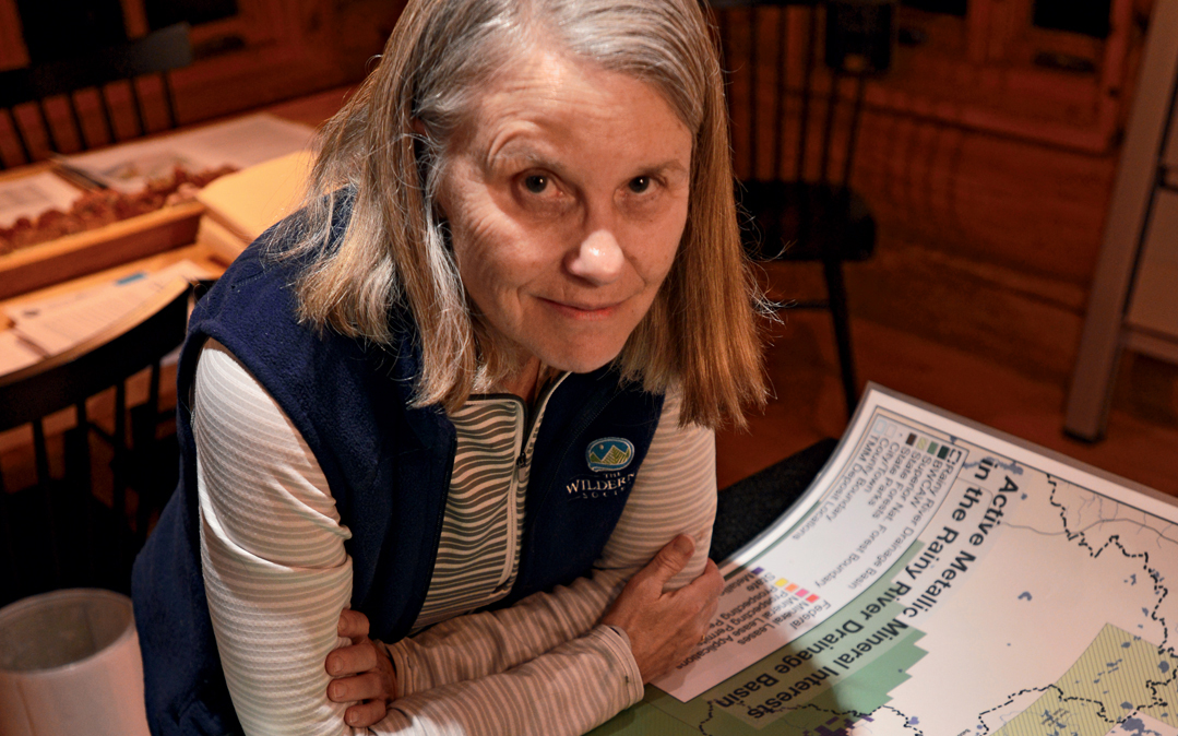 Becky Rom, head of the Save the Boundary Waters campaign, studies a map of mining claims.