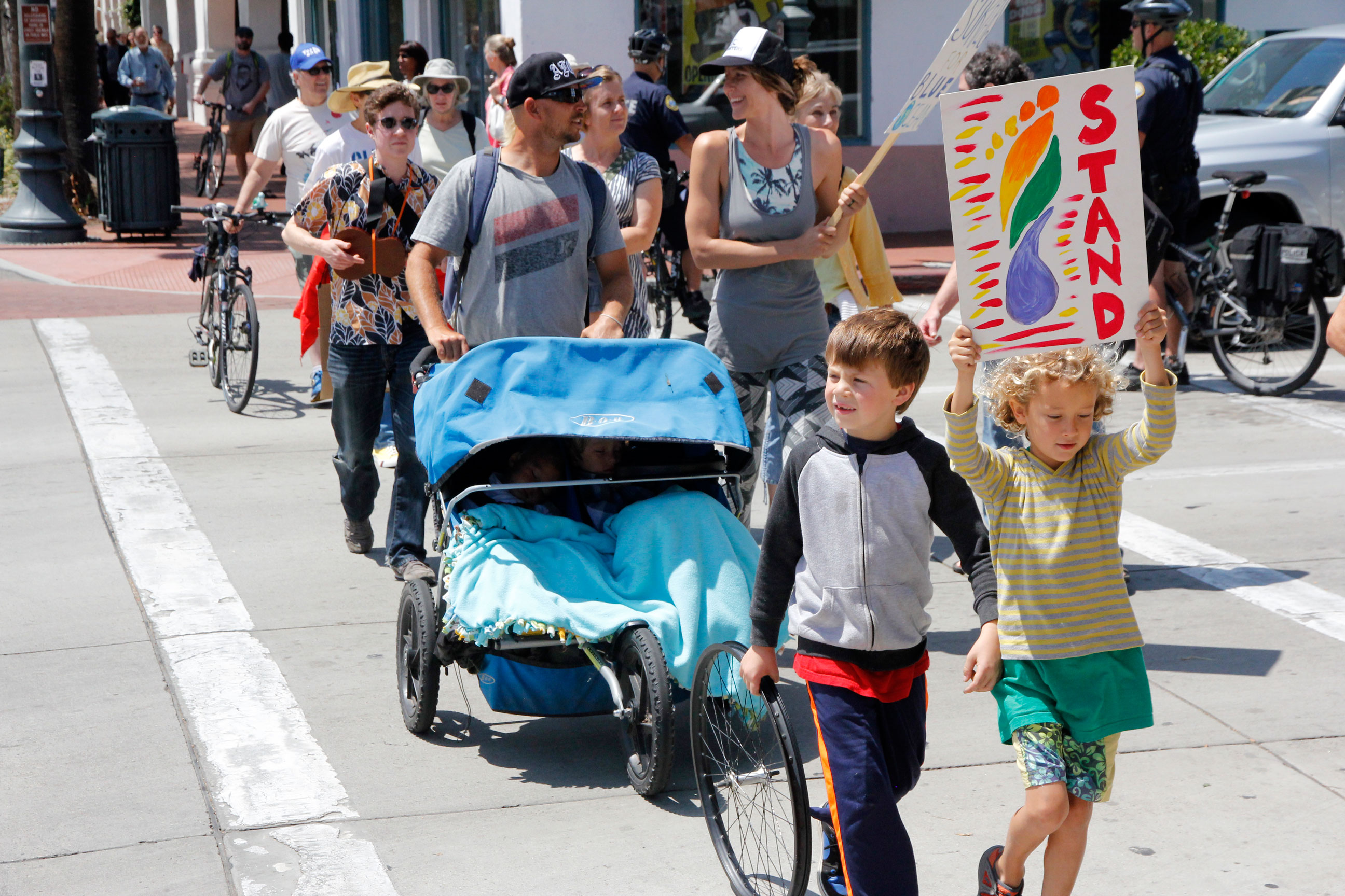 Ralliers march down the streets of Santa Barbara in response to the Refugio State Beach oil spill. 