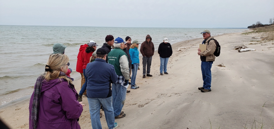 Naturalist Jim Buchholz group from Sierra Club and Friends of the Black River Forest  on a tour of some of the rare dunes at Kohler-Andrae as part of Wisconsin Loves Parks day.