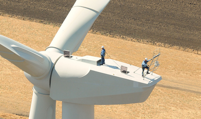 Workers on top of a wind turbine
