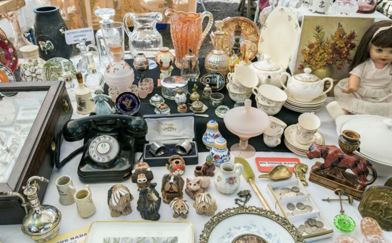Table of vases, glass figurines, and antique knick knacks