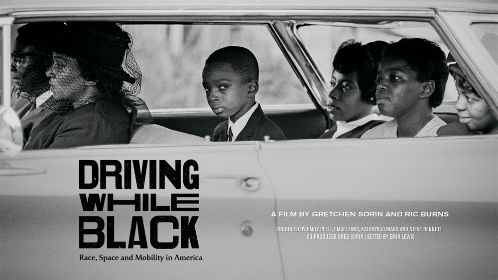 B&W image of a well-dressed black family driving in a car, movie cover image