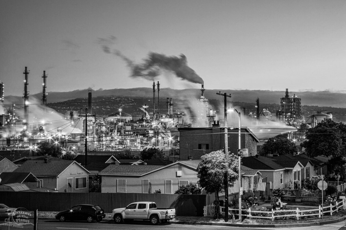 Residential houses next to oil refinery at Wilmington.