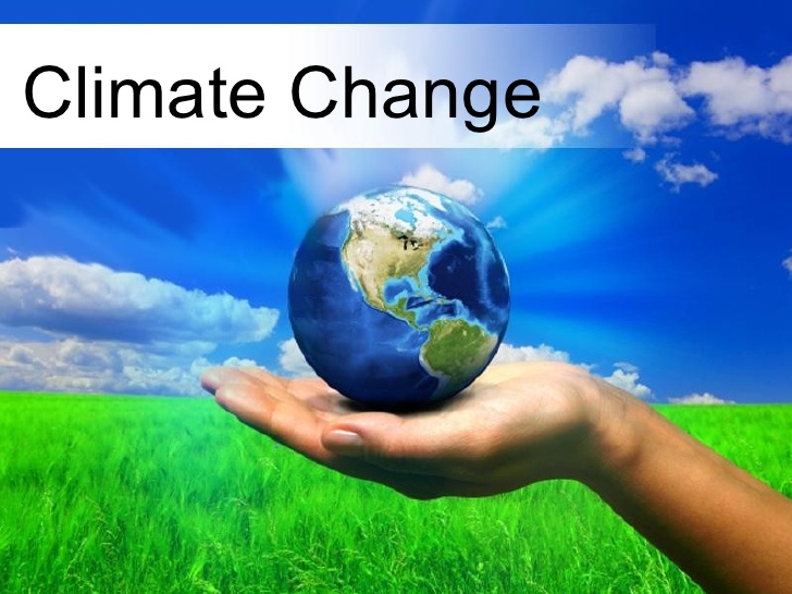 A hand holding a globe with the text "Climate Change" above the globe.