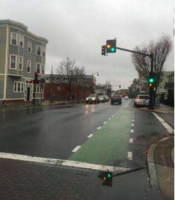 A city street with a painted bike lane infrastructure