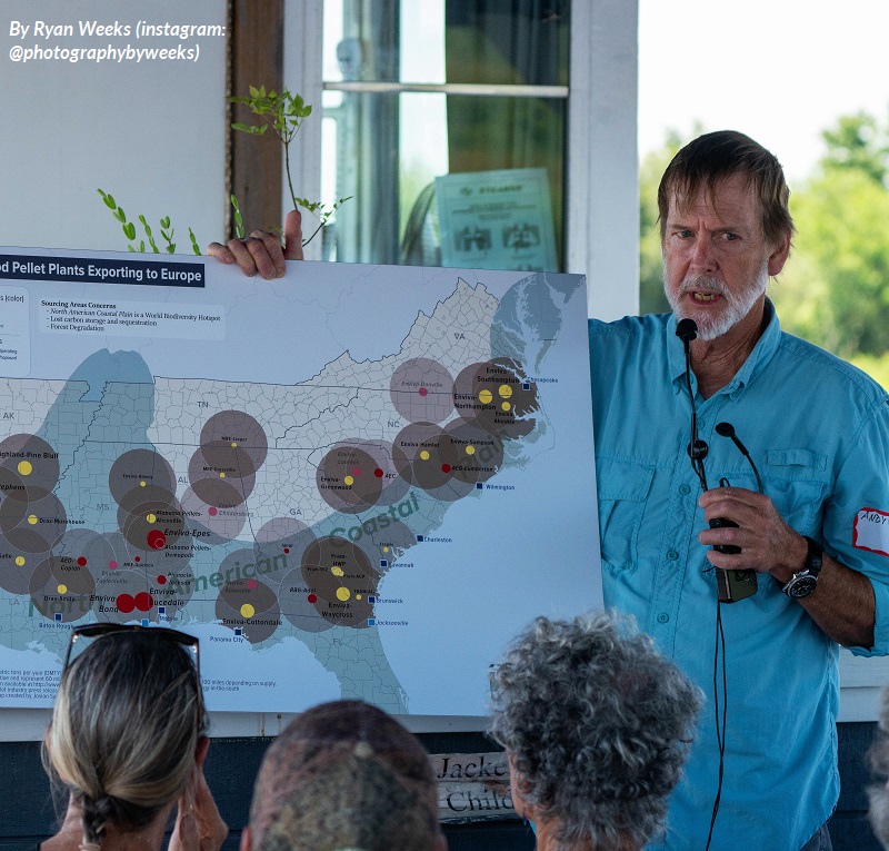 Andy Wood of the Coastal Plain Conservation Group shows a map of wood pellet production in North Carolina to guests on a cruise along the Cape Fear River