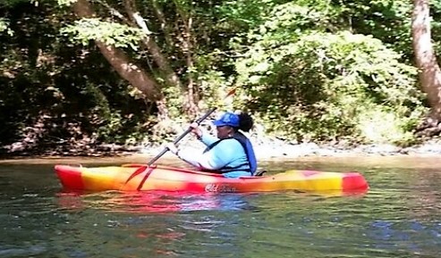 Nicole Gaines is shown kayaking on the Dan River