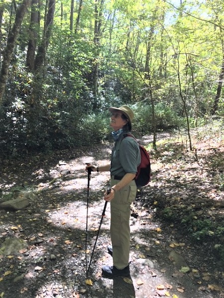 Wes Wallace is shown enjoying a hike in the woods