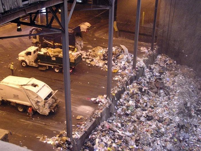 photo of garbage trucks unloading at the Hennepin Energy Recovery Center (HERC) - the garbage burner