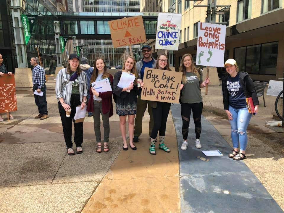 University of Minnesota Sierra Student Coalition showed up early to the Rochester People's Climate March to help gather petition signatures for 100% renewable energy.  photo credit: UMN Sierra Student Coalition