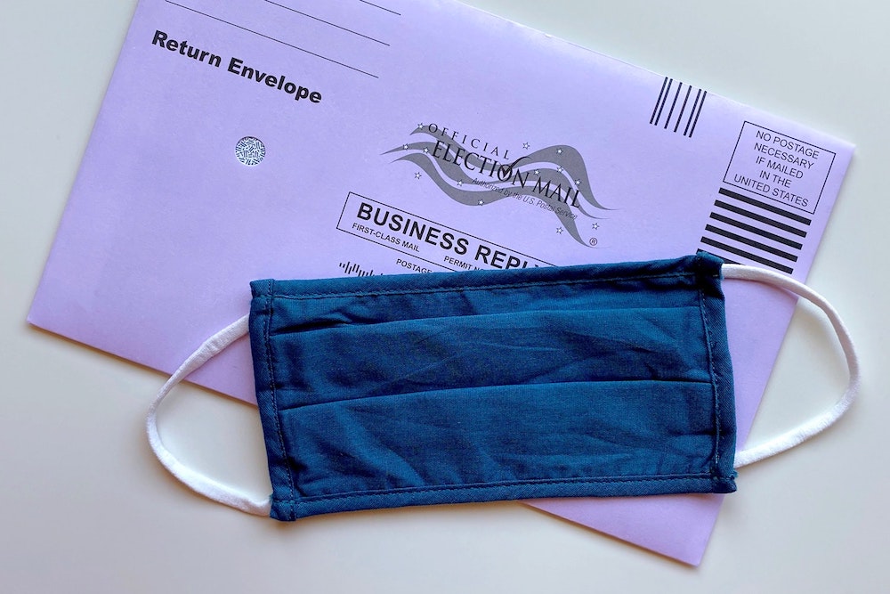 Angled mail-in ballot covered by a angled blue cloth mask 