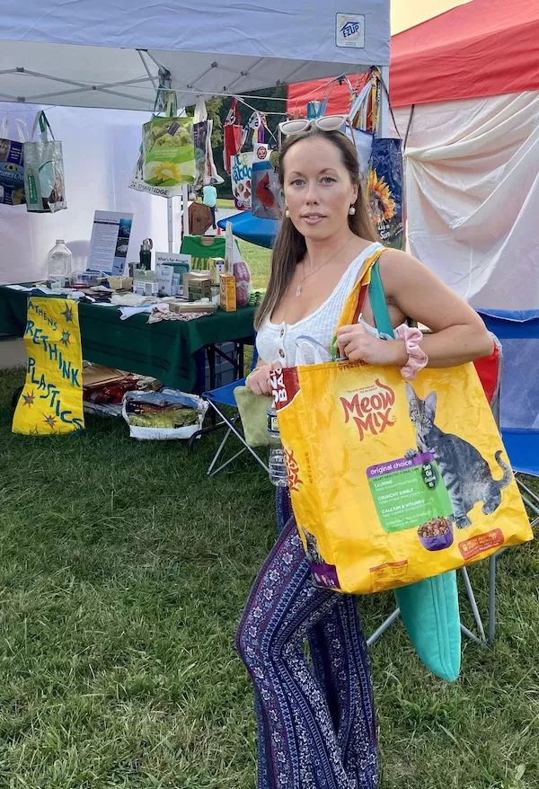 Individual holding upcycled bag at festival