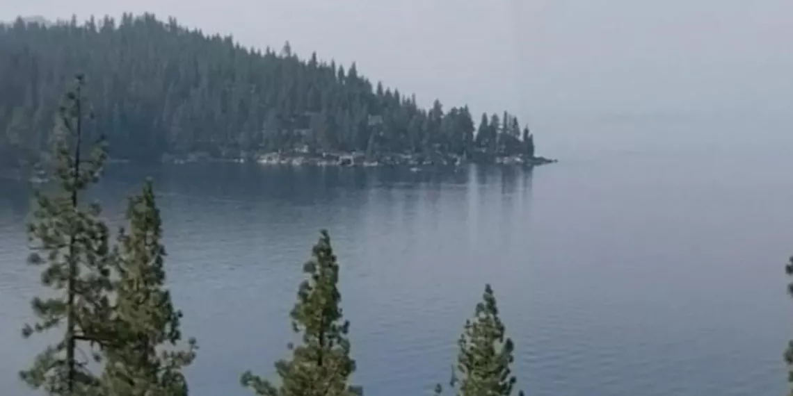 a landscape photo of Lake Tahoe in 2021, screened in by wildfire smoke, taken by Debbie Neustadt