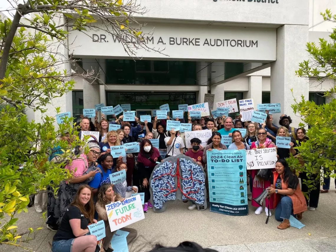 Climate activists rally before the meeting at SCAQMD