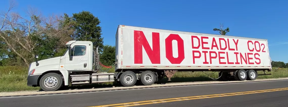 Semi with "No deadly CO2 pipelines" on its side