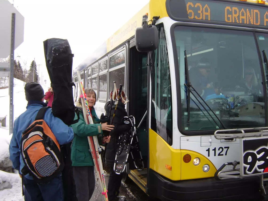 Deb Alper boards a bus with Sierra Club friends for a winter outing to Battle Creek Regional Park in Maplewood (2010). Photo: Joshua Houdek