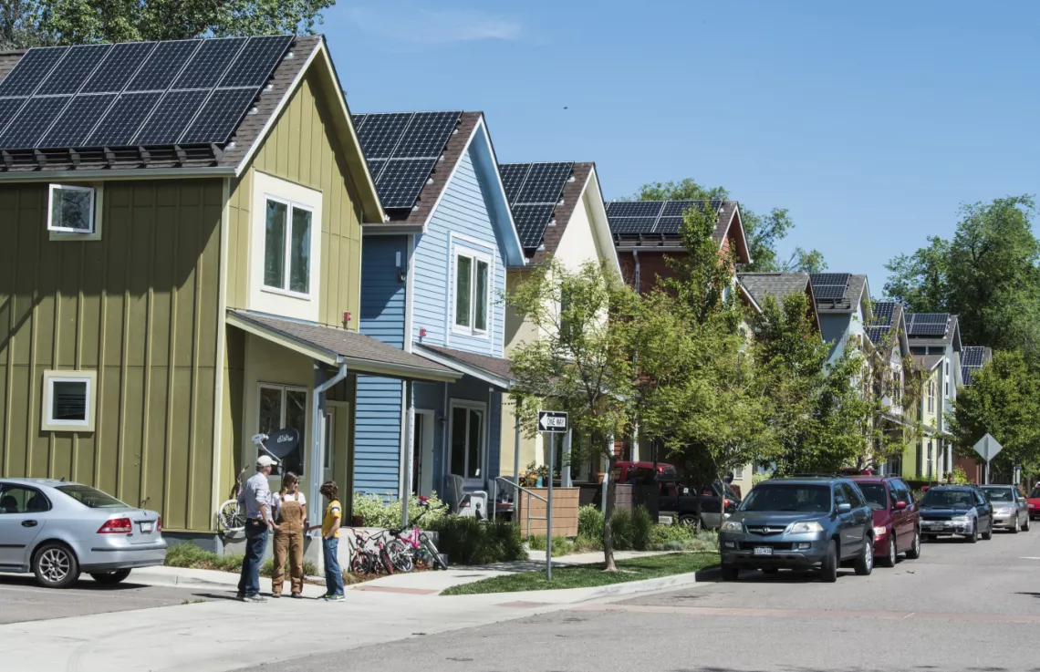 houses with solar panels on roofs