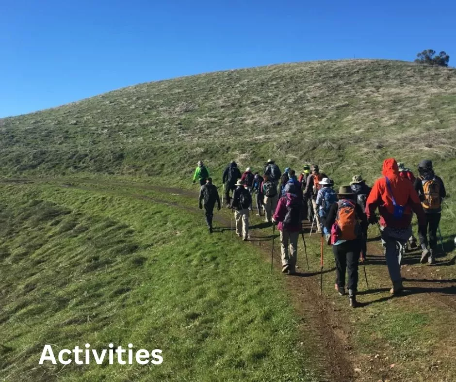 Hikers in green landscape, text Activities