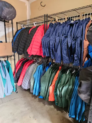 Hanging jackets in storeroom