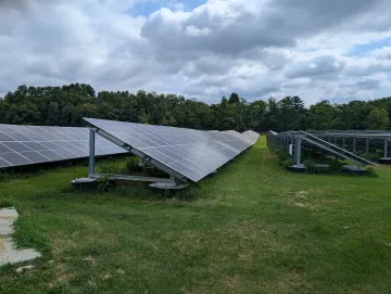 Solar panels in a grassy field