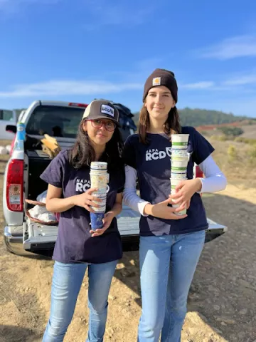 Two girls helping with RCD cleanup