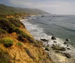 California coast, light surf under an overcast sky