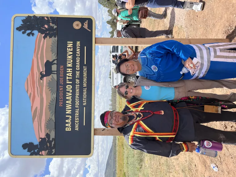 Stuart Chavez, Sandy Bahr, Carletta Tilousi standing in front of the newly designated Baaj Nwaavjo I’tah Kukveni National Monument.