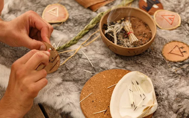 An indigenous person's hands weaving.