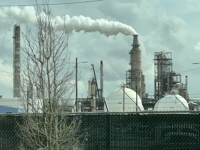 houaton fossil fuel plant with smoke cloud