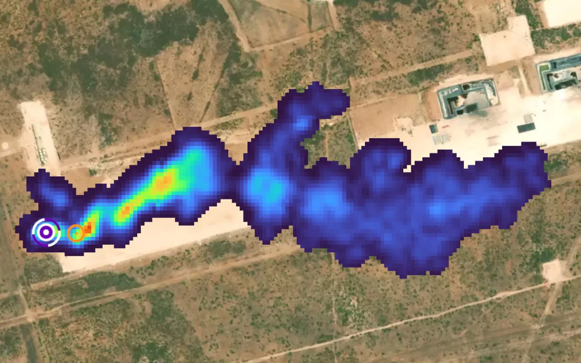 Satellite or aircraft aerial photo of a dark-blue-colored methane plume rising up from a source in a flat, dry area of Midland, Texas