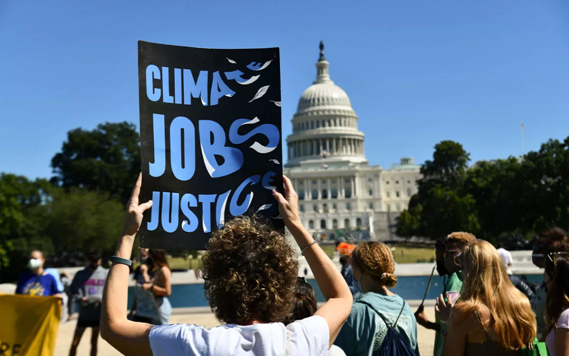 Environmental activists gather near the U.S. Capitol as part of a global climate strike to demand government action to combat climate change.