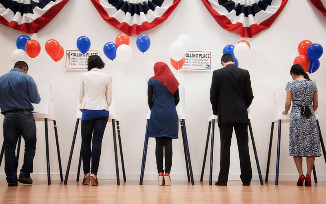 Voters voting in polling place.